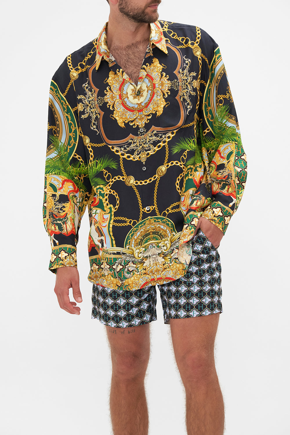 Side view of model wearing Hotel Franks by CAMILLA mens silk oversized sleeve button through shirt in Jealousy and Jewels print