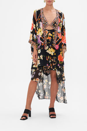 Front view model wearing of CAMILLA floral silk kimono layer in Secret History print