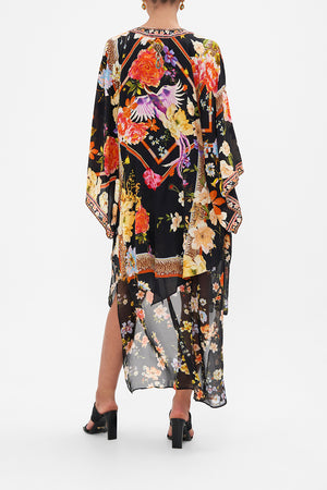 Back view model wearing of CAMILLA floral silk kimono layer in Secret History print